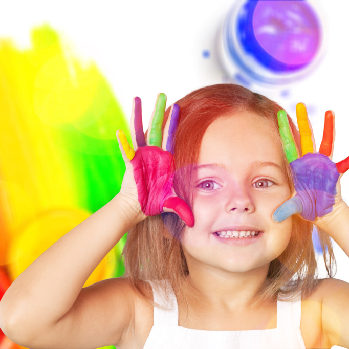 little-girl-showing-painted-hands-background